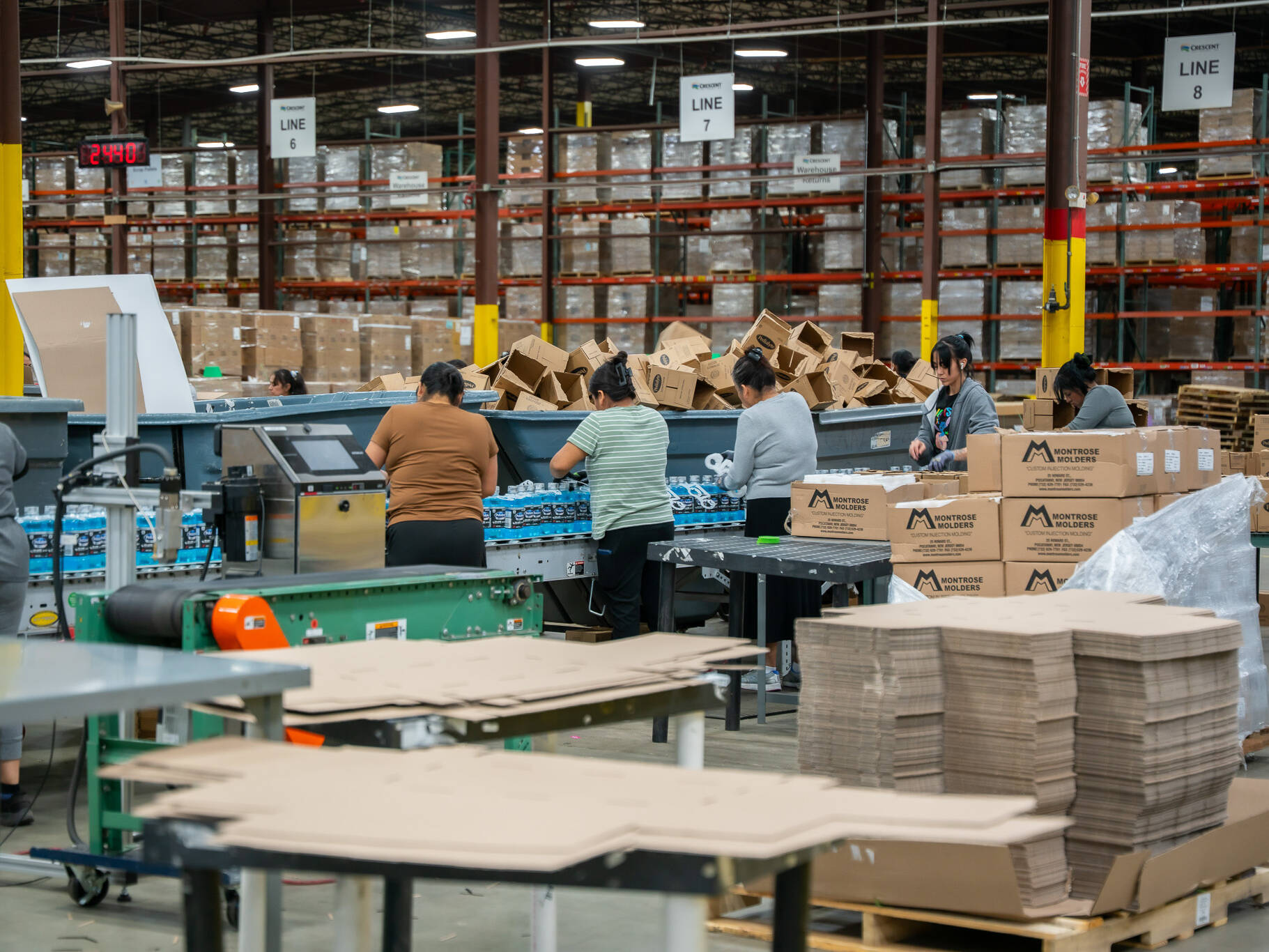 many employees working quickly in fulfillment center