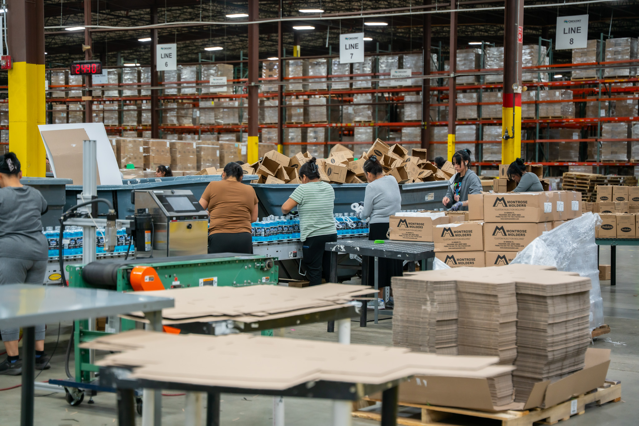 many employees working quickly in fulfillment center